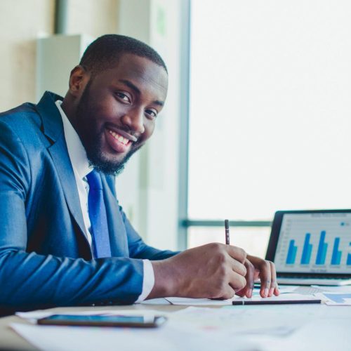 smiling-businessman-signing-contract